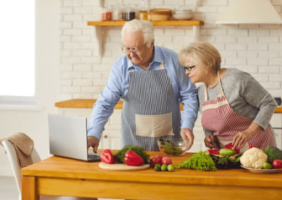 Elderly couple cooking in the kitchen