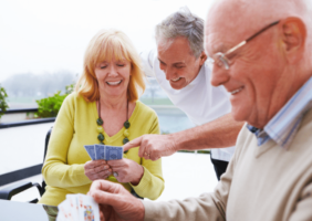 Friends playing cards at home