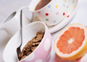 Cup of tea, bowl of bran flakes and half a grapefruit