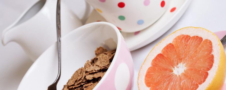 Cup of tea, bowl of bran flakes and half a grapefruit