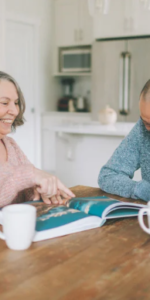 Elderly couple enjoying a cup of tea in the kitchen