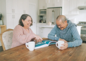 Elderly couple enjoying a cup of tea in the kitchen