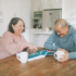 Elderly couple enjoying a cup of tea in the kitchen